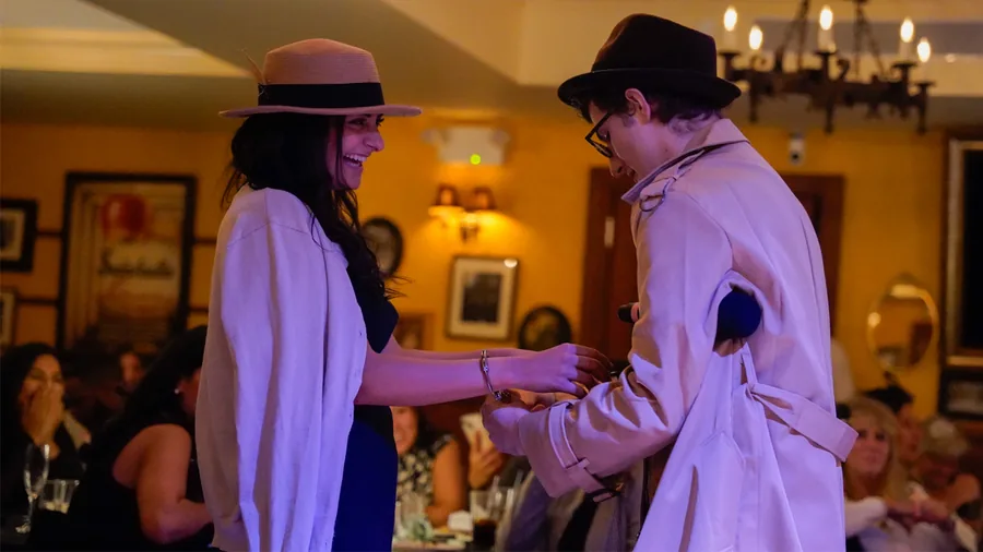 A Murder Mystery Company detective questioning a guest at a Orlando show