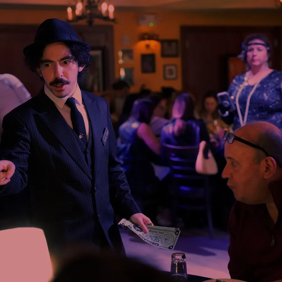 A Murder Mystery Company actor working the room at a Orlando show